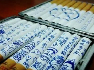为了让爸爸戒烟,韩国小男孩在烟上作画